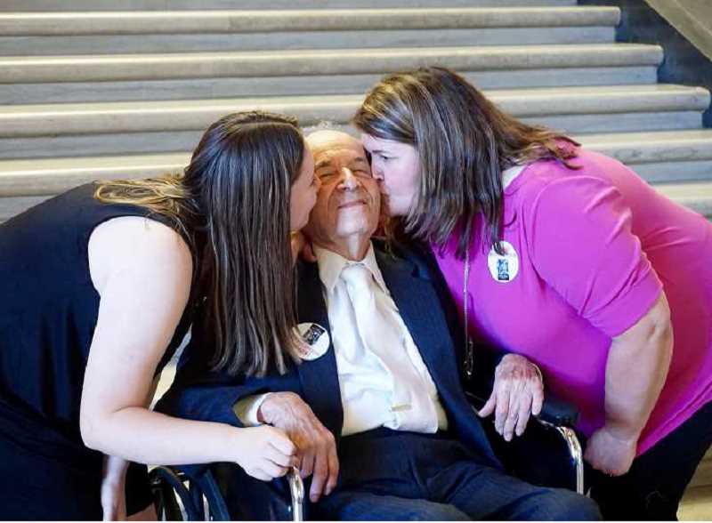 REVIEW PHOTO: CLAIRE HOLLEY - Lakeridge freshman Claire Sarnowski and her mom, Carol, show their affection for Holocaust survivor Alter Wiener in September after testifying in front of the Senate Committee on Education about the importance of Holocaust education. 