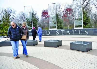  Jenn and Richard Pizzi, of Bloomfield Hills, walk through the Veterans Tribute Nov. 11 in Oakland Township. Richard Pizzi is a Vietnam War Army veteran. 