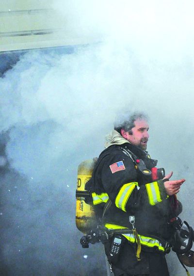  Rochester firefighter and EMT David Wood, left, runs through a search and rescue drill Jan. 12 with firefighters Adam Semaan, center, and Sean Frontiera, right, before they enter a training tower at the municipal fire training center — a reuse of the property that at one time was the city’s waste plant — on Letica Road. 