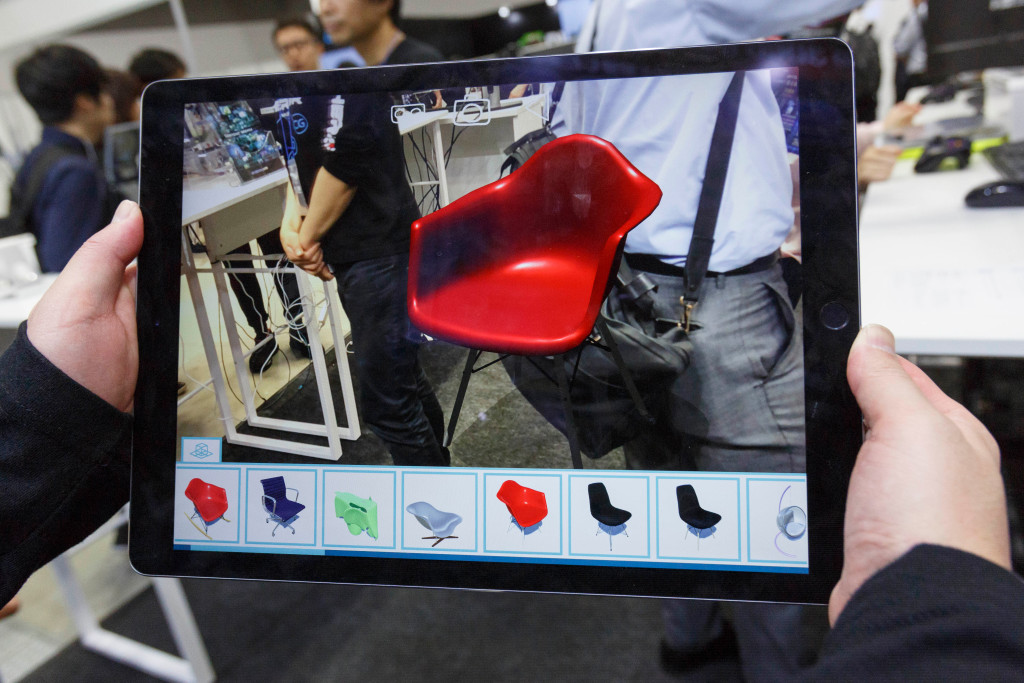 An exhibitor shows the Augmented Reality (AR) app Dream AR during the 26th 3D & Virtual Reality Expo (IVR)Tokyo Big Sight, Tokyo, Japan - 20 Jun 2018 The annual exhibition IVR is the biggest trade show in Japan that focuses on 3D and Virtual Reality industry. The exhibition is held from June 20 to 22.