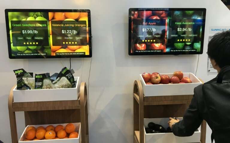 Chinese retail giant Suning's exhibit at the Consumer Electronics Show shows a smart weighing counter that can enable consumers