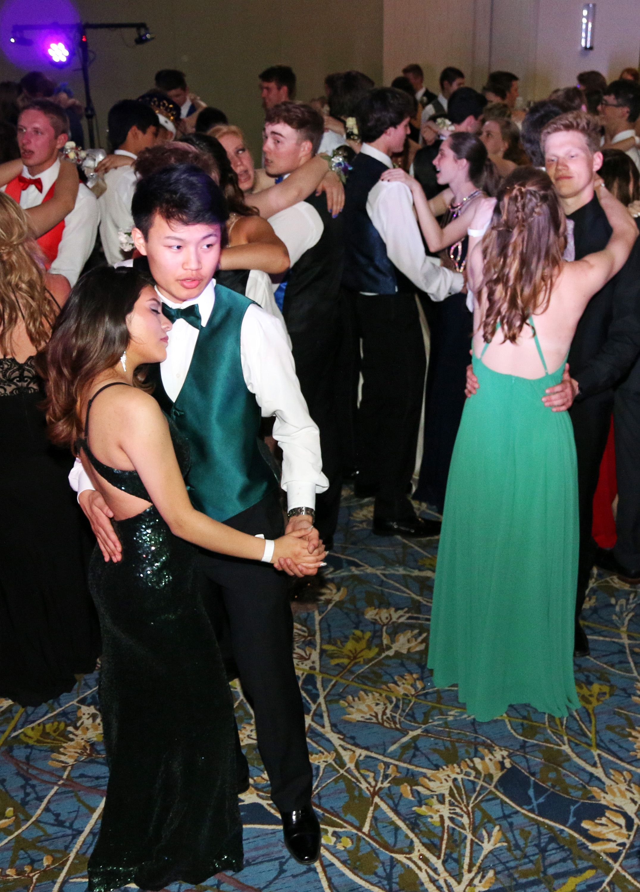 Couples enjoy a slow dance as a Ed Sherran songs plays