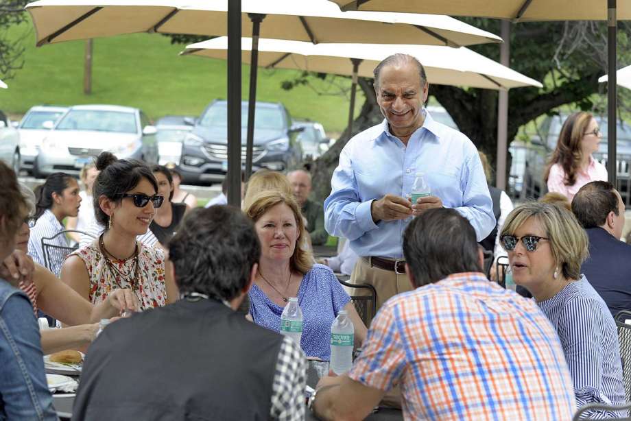 Ethan Allen Interiors CEO Farooq Kathwari mingles with employees and guests at a June 2017 company picnic. The Danbury, Conn.-based company enters the spring of 2019 with plans for a major expansion of its outdoor furnishings, including two new collections called Redding Ridge and Nod Hill. Photo: Carol Kaliff / Hearst Connecticut Media / The News-Times