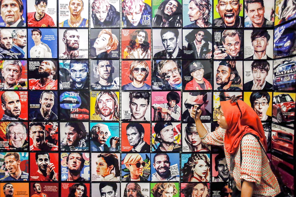 A visitor taking a selfie at the pop-art section in BookXcess Kong Heng in Ipoh. — Picture by Farhan Najib